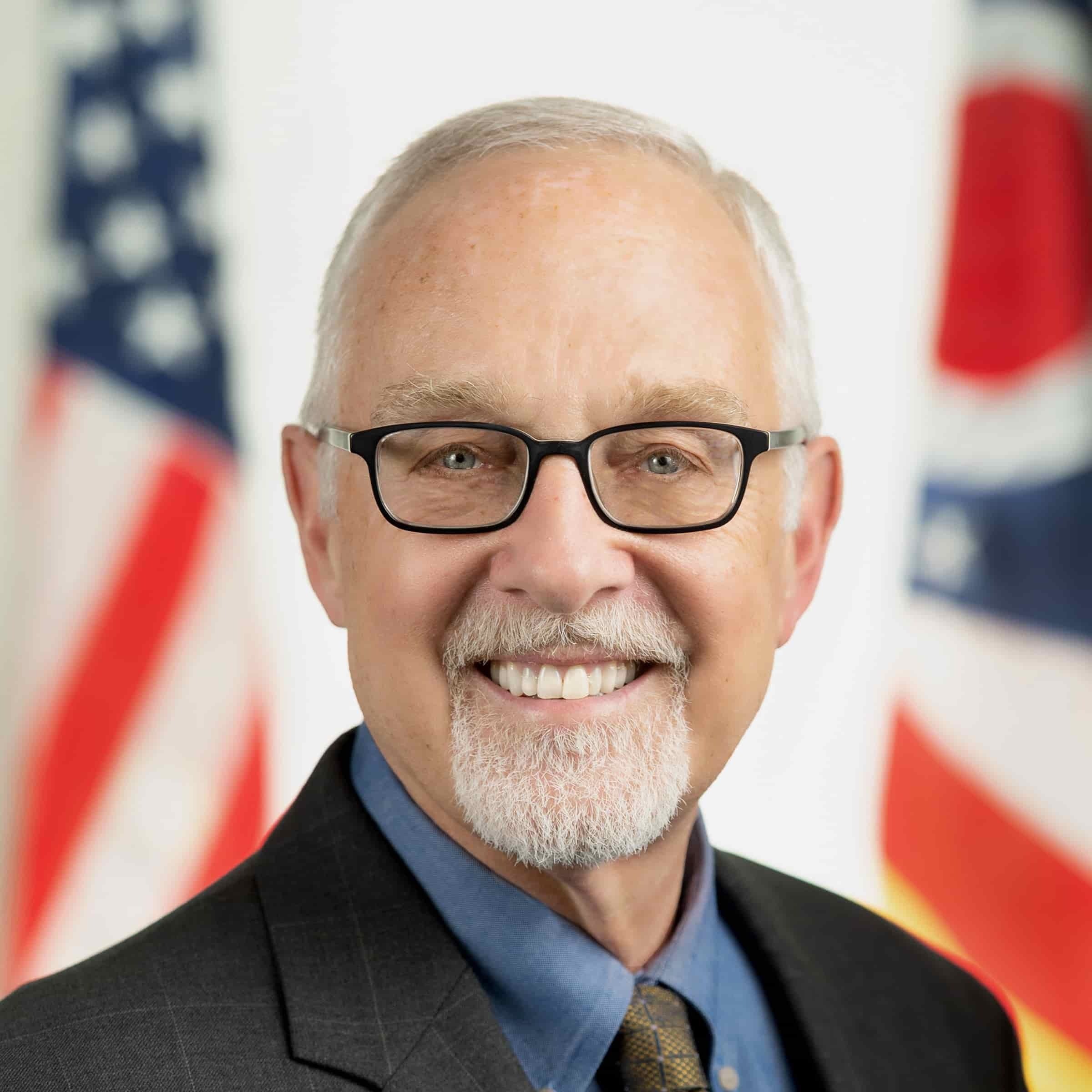 IMG_5873 Kirk Herath Headshot Flags